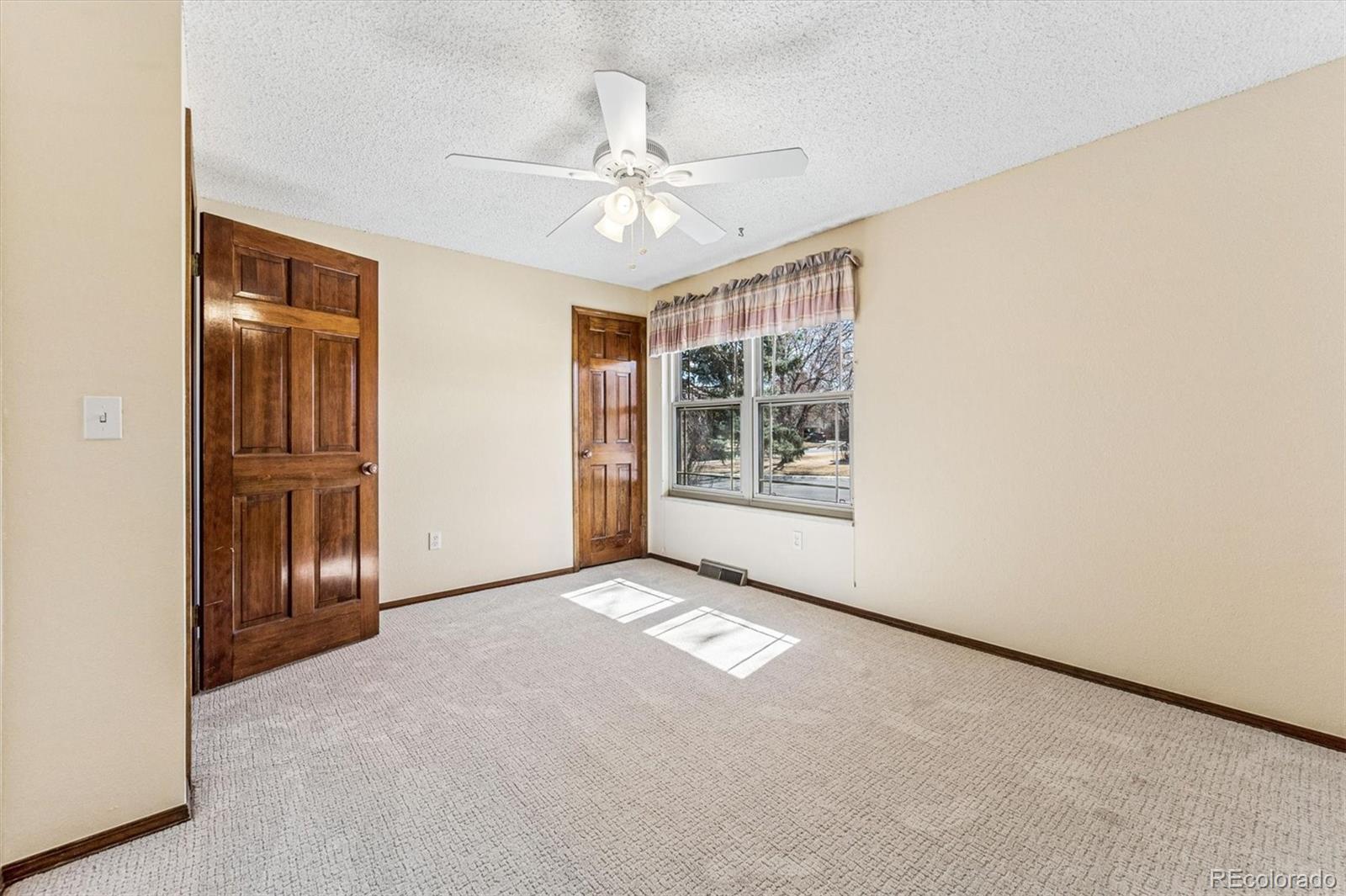 6505 West 34th Avenue Wheat Ridge, CO 80033 - Photo 15 of 28 an empty room with windows and closet