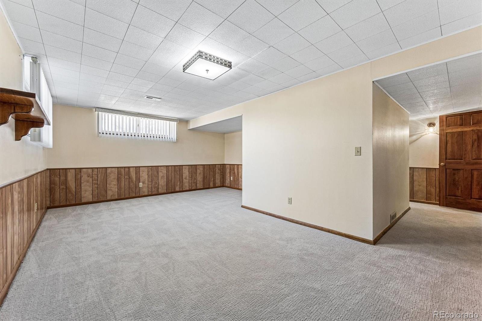 6505 West 34th Avenue Wheat Ridge, CO 80033 - Photo 17 of 28 an empty room with windows