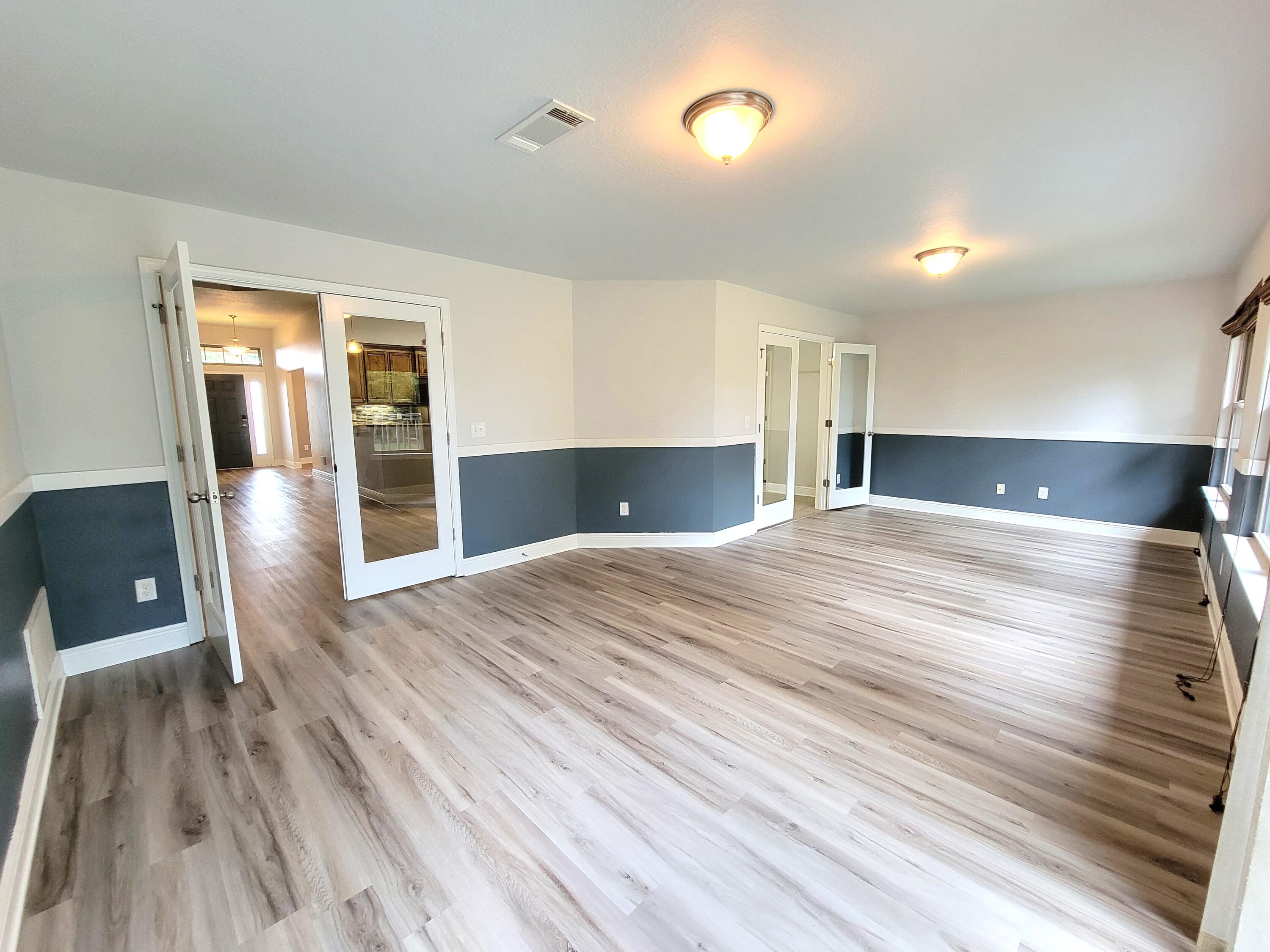 505 Vale Loop Crestview, FL 32536 - Photo 13 of 14 a view of empty room with wooden floor