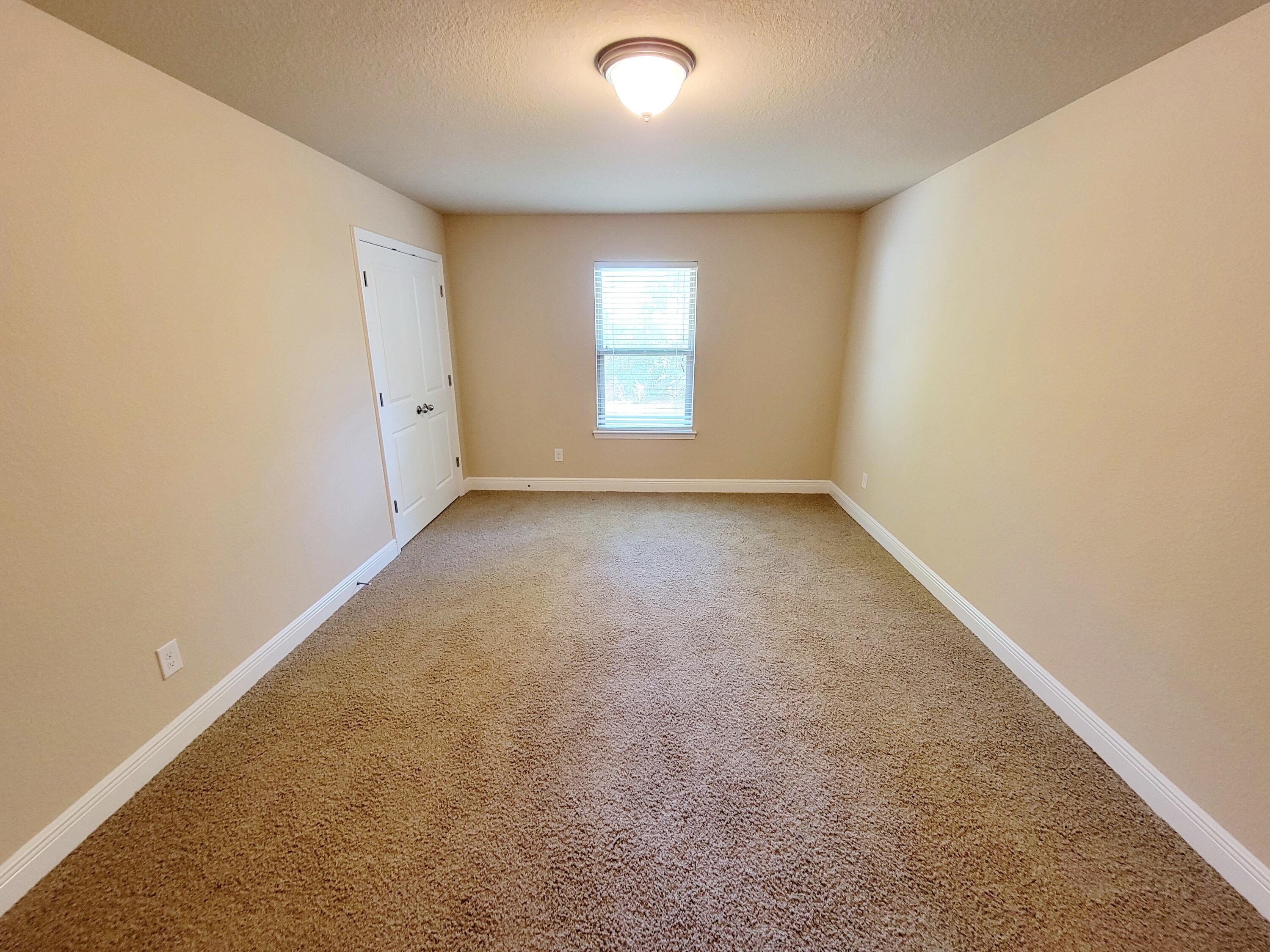 505 Vale Loop Crestview, FL 32536 - Photo 14 of 14 an empty room with windows