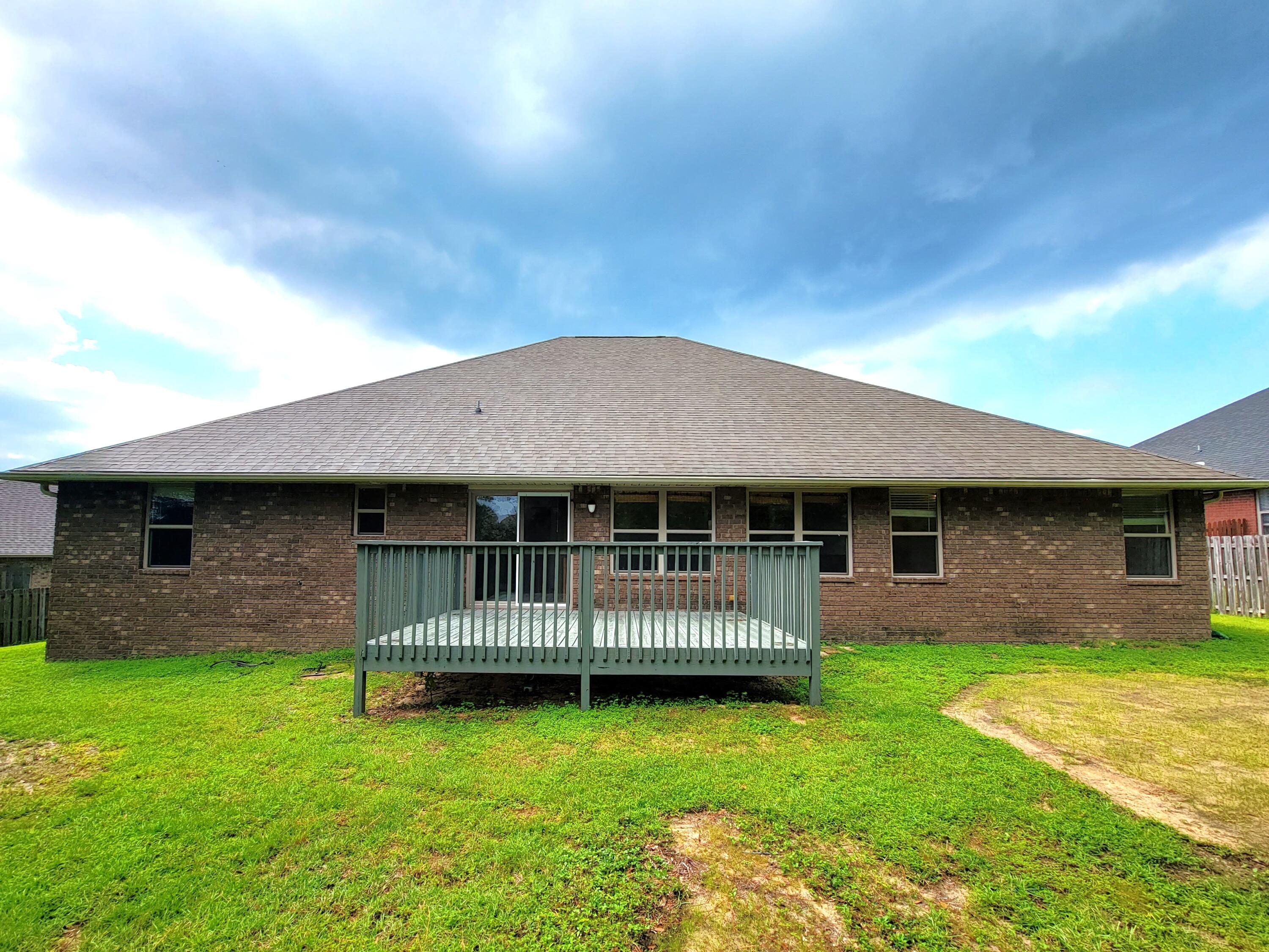 505 Vale Loop Crestview, FL 32536 - Photo 2 of 14 a front view of house with a garden