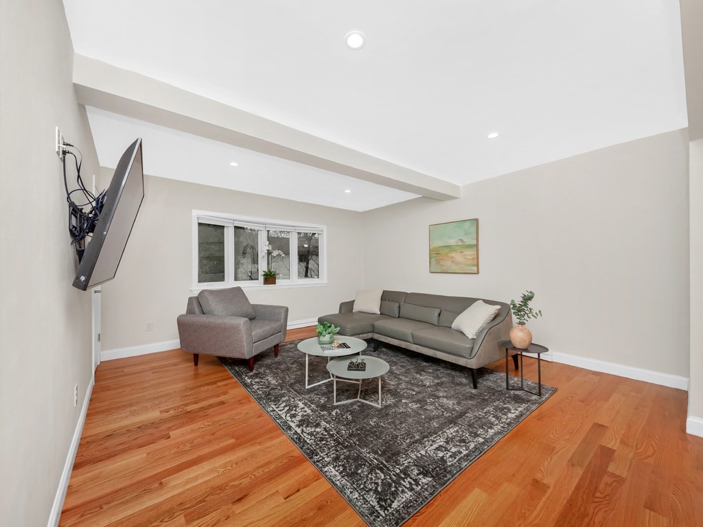 128 Olde Field Road Newton, MA 02459 - Photo 15 of 36 a living room with furniture and a rug