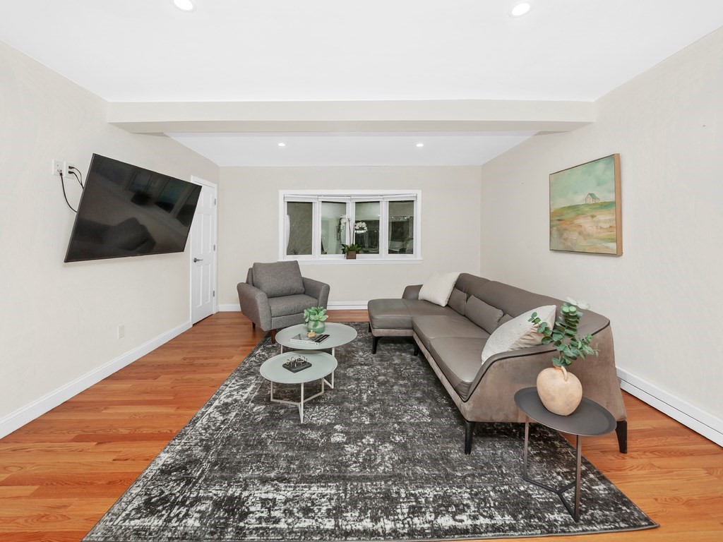 128 Olde Field Road Newton, MA 02459 - Photo 16 of 36 a living room with furniture and a flat screen tv