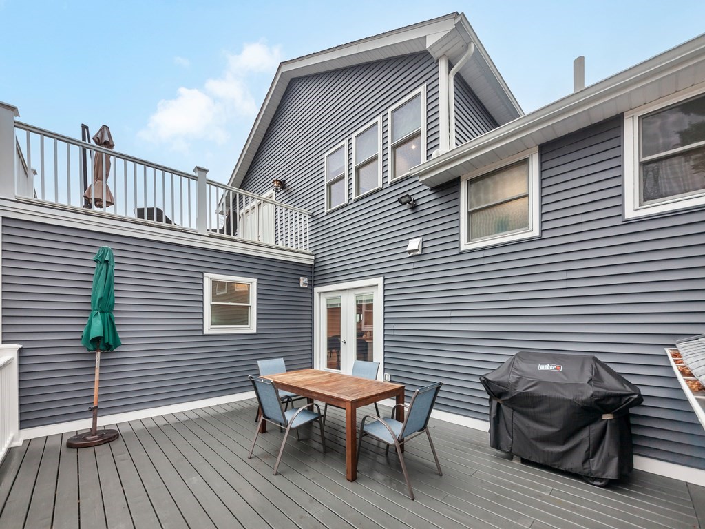 128 Olde Field Road Newton, MA 02459 - Photo 19 of 36 a view of a house with wooden deck