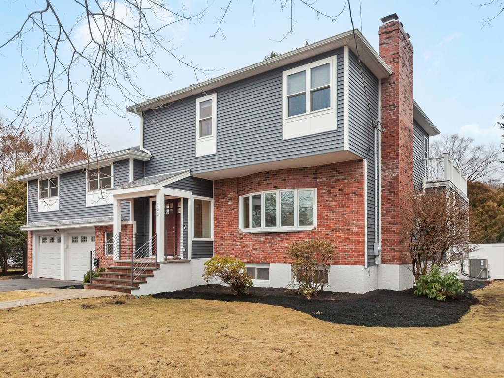 128 Olde Field Road Newton, MA 02459 - Photo 2 of 36 a front view of a house with a yard