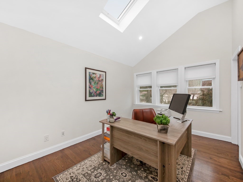 128 Olde Field Road Newton, MA 02459 - Photo 27 of 36 a living room with furniture and wooden floor