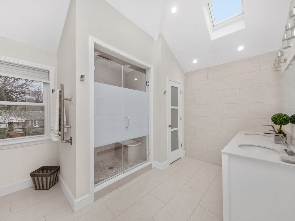 128 Olde Field Road Newton, MA 02459 - Photo 28 of 36 a bathroom with a shower and a sink