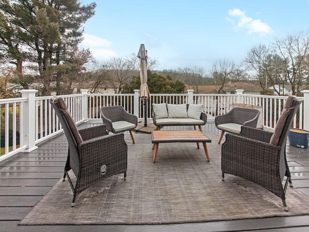 128 Olde Field Road Newton, MA 02459 - Photo 30 of 36 a view of a chair and table on the roof deck