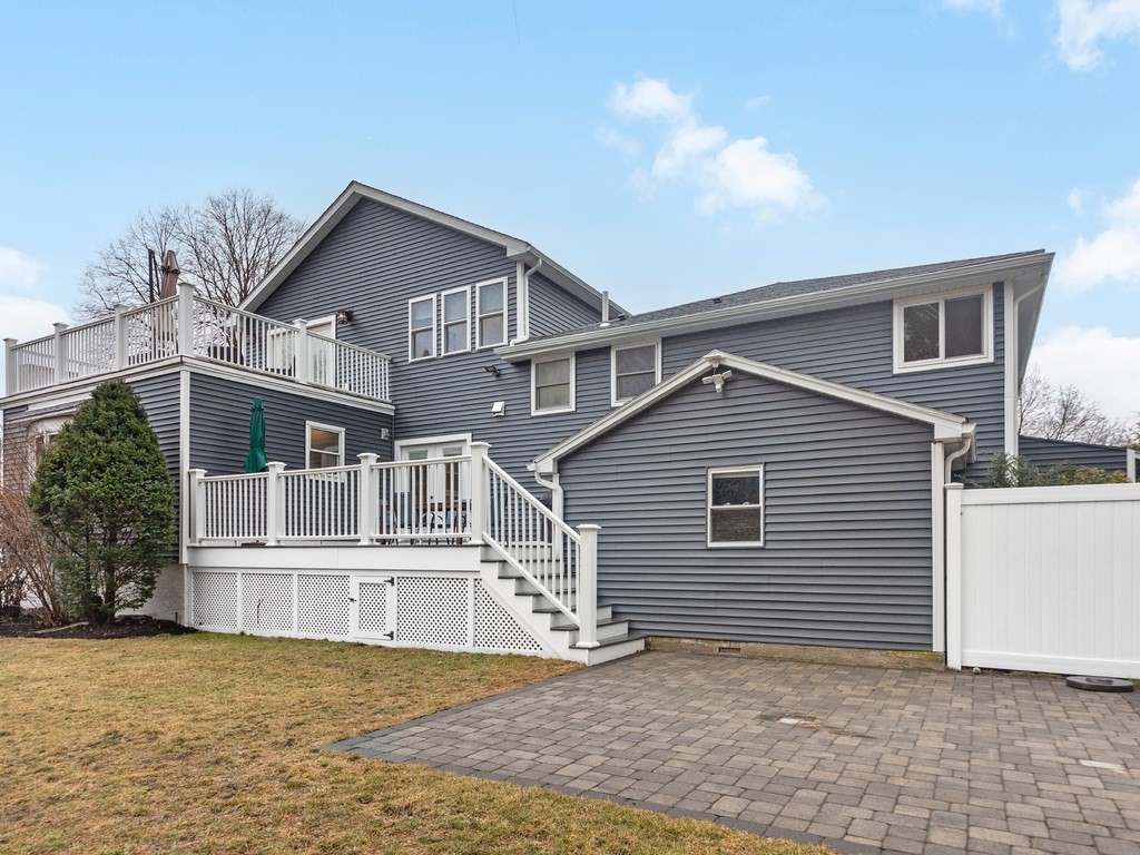128 Olde Field Road Newton, MA 02459 - Photo 3 of 36 a view of a house with a yard and potted plants