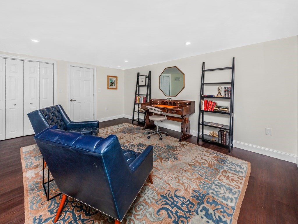 128 Olde Field Road Newton, MA 02459 - Photo 35 of 36 a living room with furniture and a wooden floor