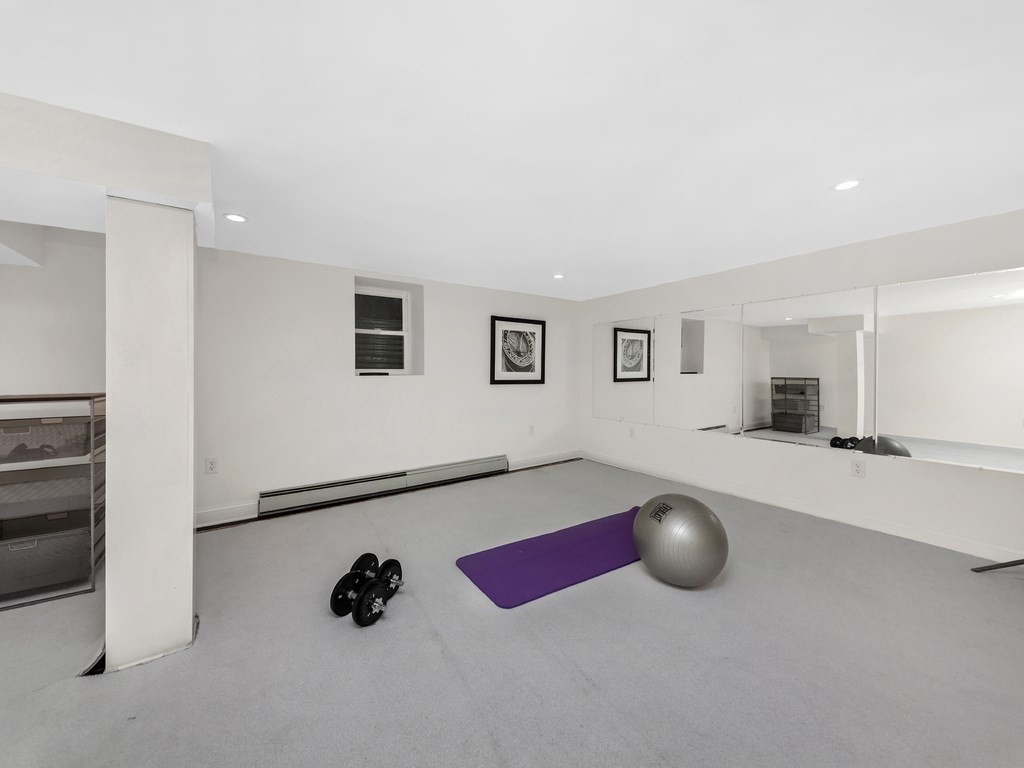 128 Olde Field Road Newton, MA 02459 - Photo 36 of 36 a room with a table and chairs