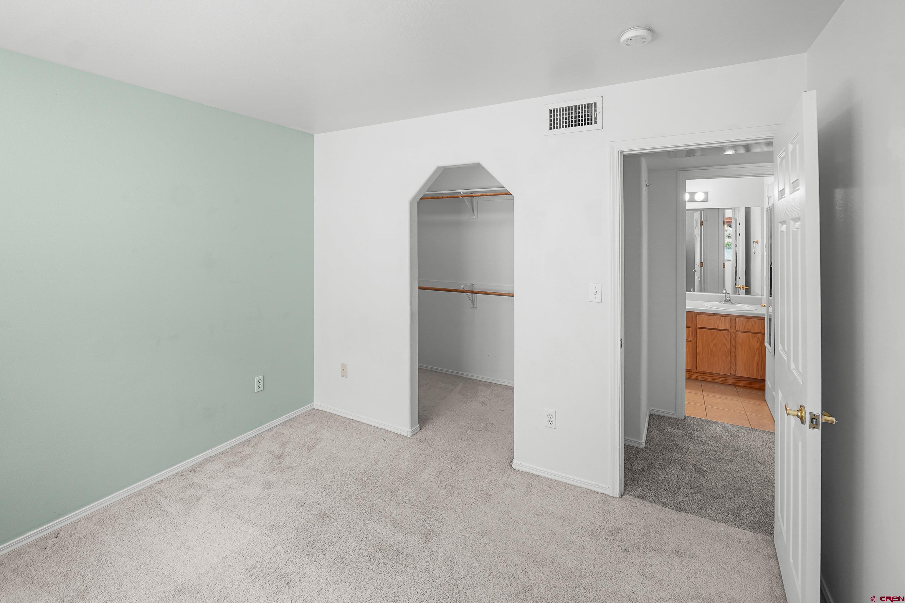 1100 Goeglein Gulch Road, Unit 163 Durango, CO 81301 - Photo 16 of 23 an empty room with closet and a bathroom