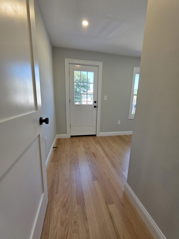 40 Lorna Road, Unit 2 Boston, MA 02126 - Photo 15 of 18 wooden floor in an empty room with a window