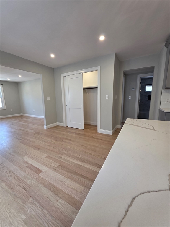 40 Lorna Road, Unit 2 Boston, MA 02126 - Photo 5 of 18 a view of a livingroom with wooden floor