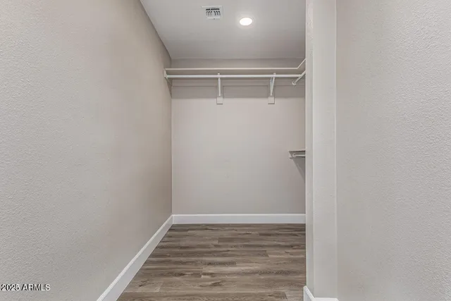 a view of an empty walk in closet