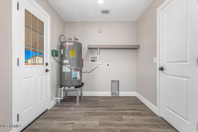 a view of an entryway with wooden floor