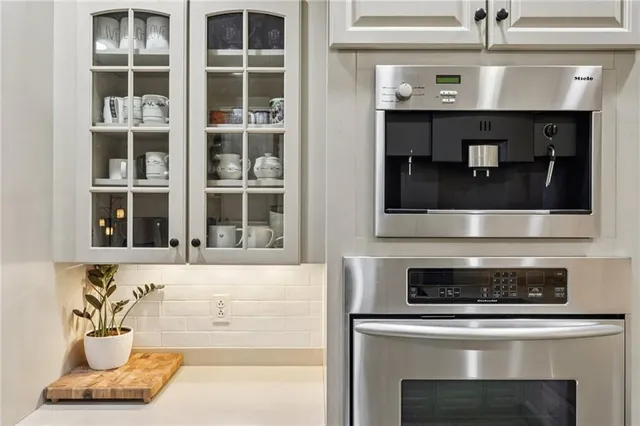 a kitchen with a stove and cabinets
