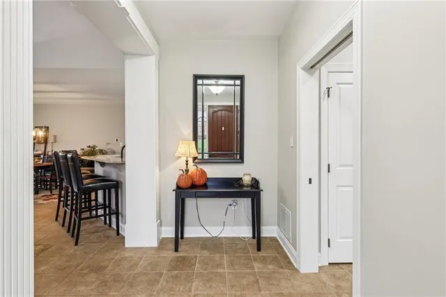 a view of hall way with furniture