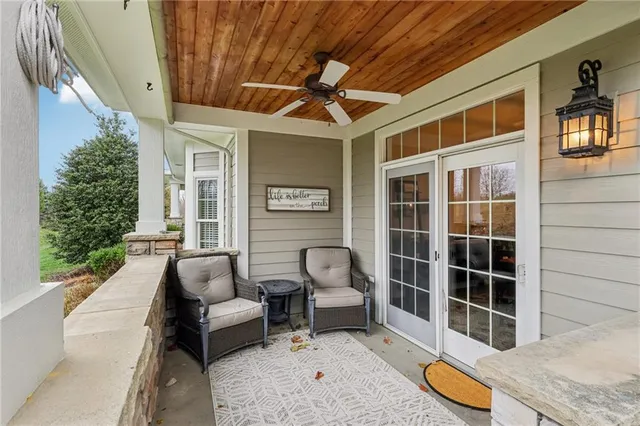 a view of a patio with table and chairs