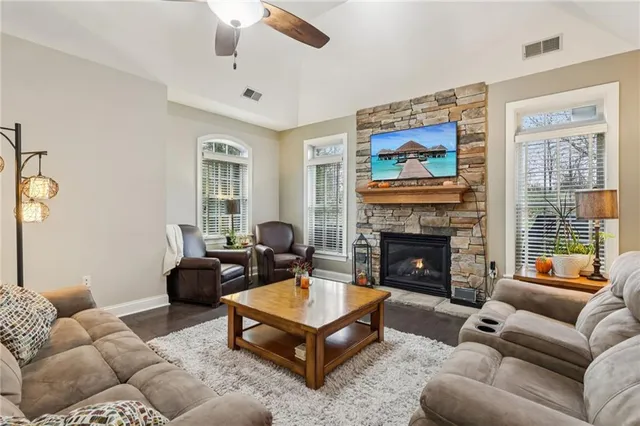 a living room with furniture and a fireplace