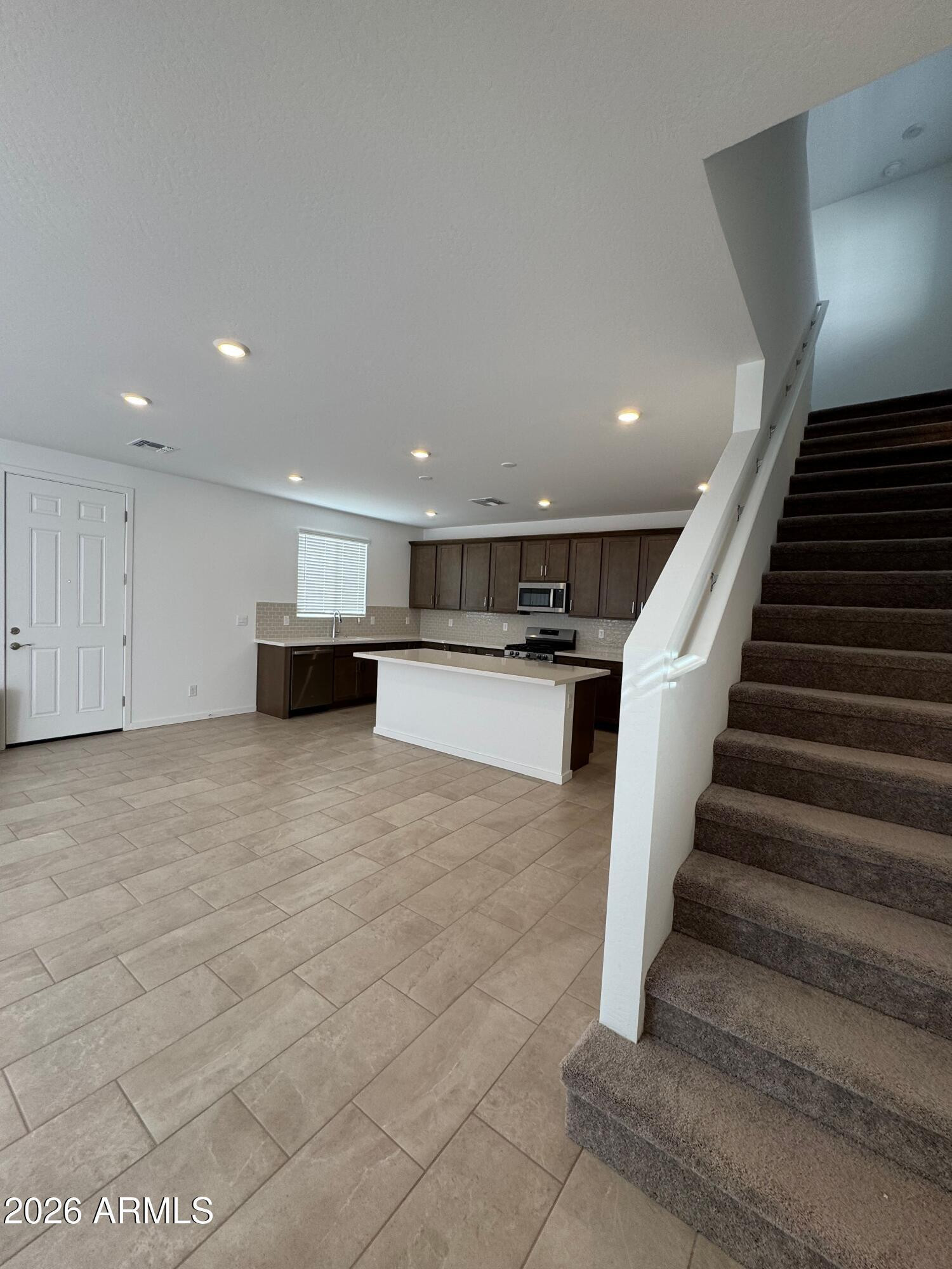 2438 West Rowel Road Phoenix, AZ 85085 - Photo 11 of 30 a view of kitchen with furniture and stairs