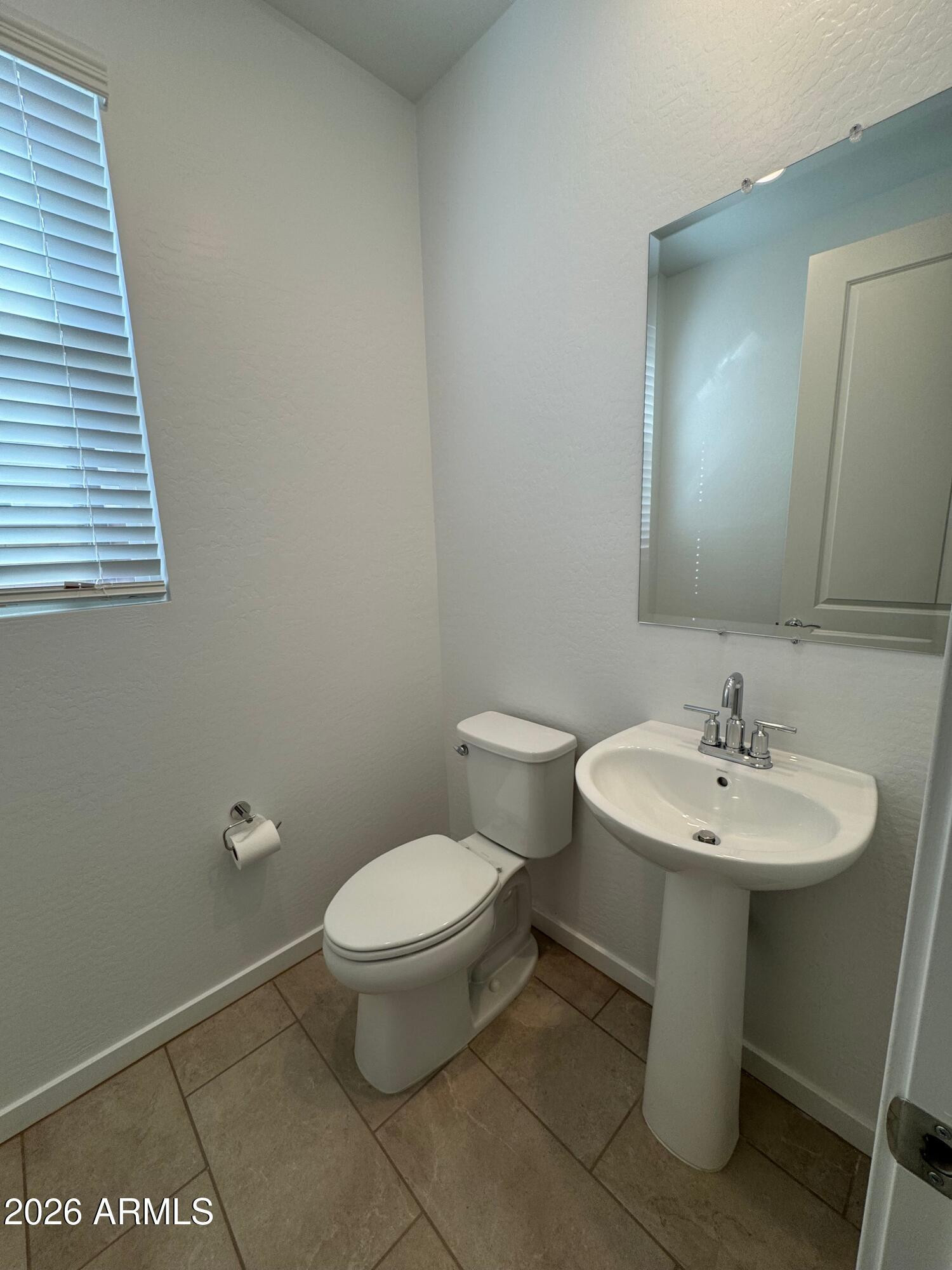 2438 West Rowel Road Phoenix, AZ 85085 - Photo 12 of 30 a bathroom with a toilet sink and mirror