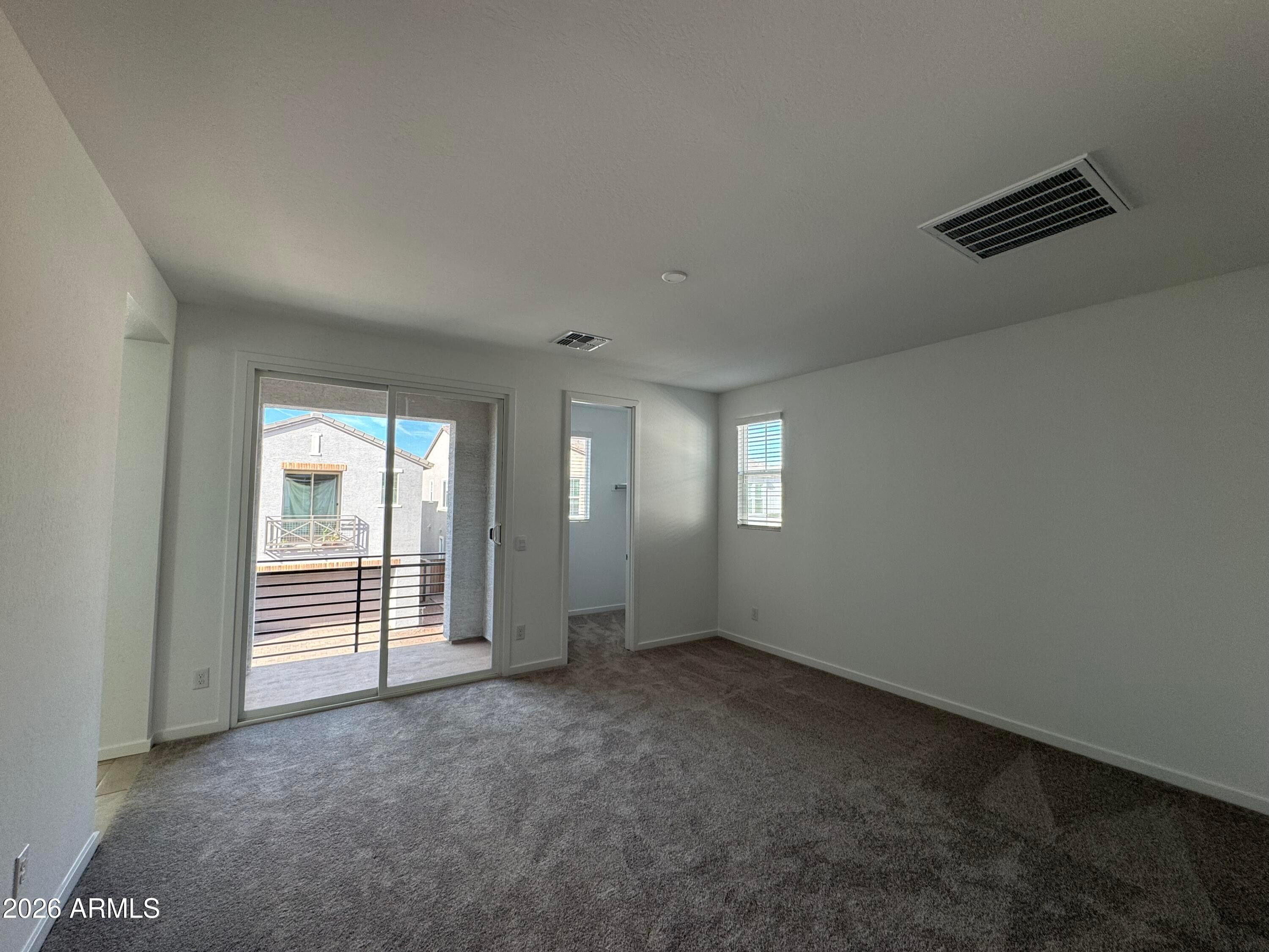 2438 West Rowel Road Phoenix, AZ 85085 - Photo 17 of 30 an empty room with windows