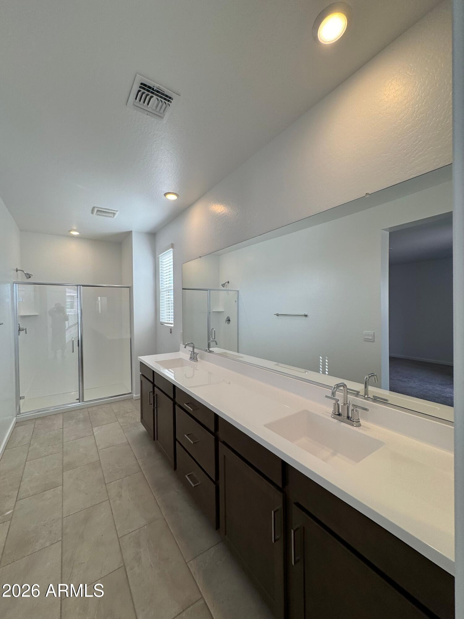 2438 West Rowel Road Phoenix, AZ 85085 - Photo 21 of 30 a bathroom with a double vanity sink and a mirror