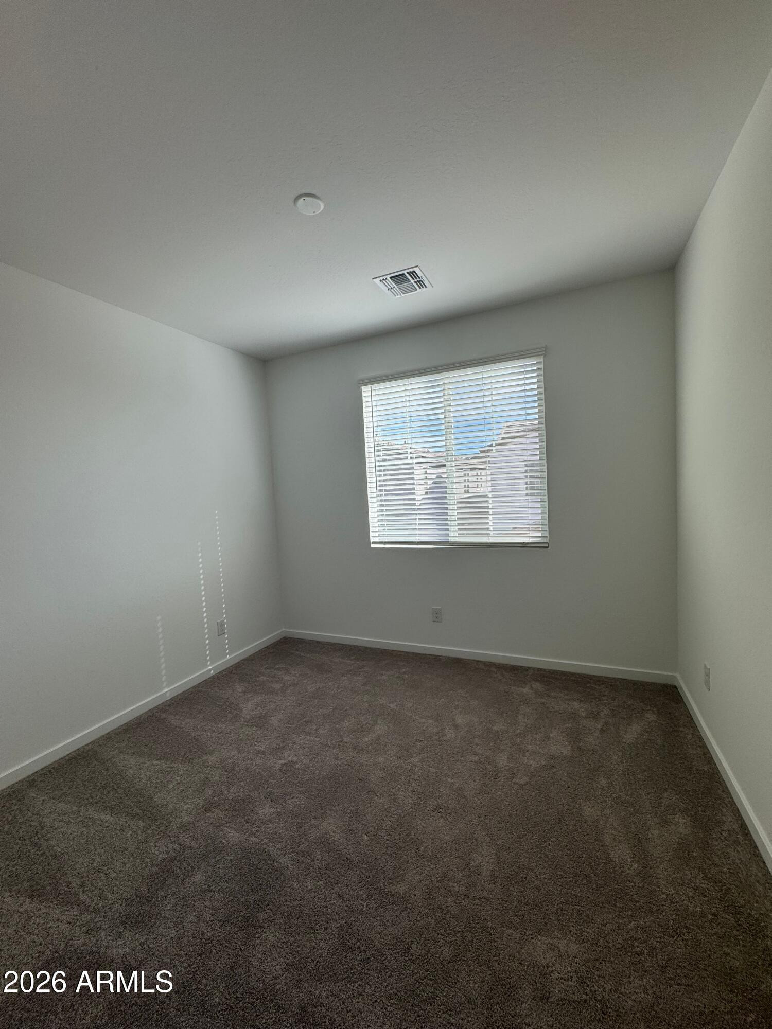 2438 West Rowel Road Phoenix, AZ 85085 - Photo 30 of 30 an empty room with a empty space and windows