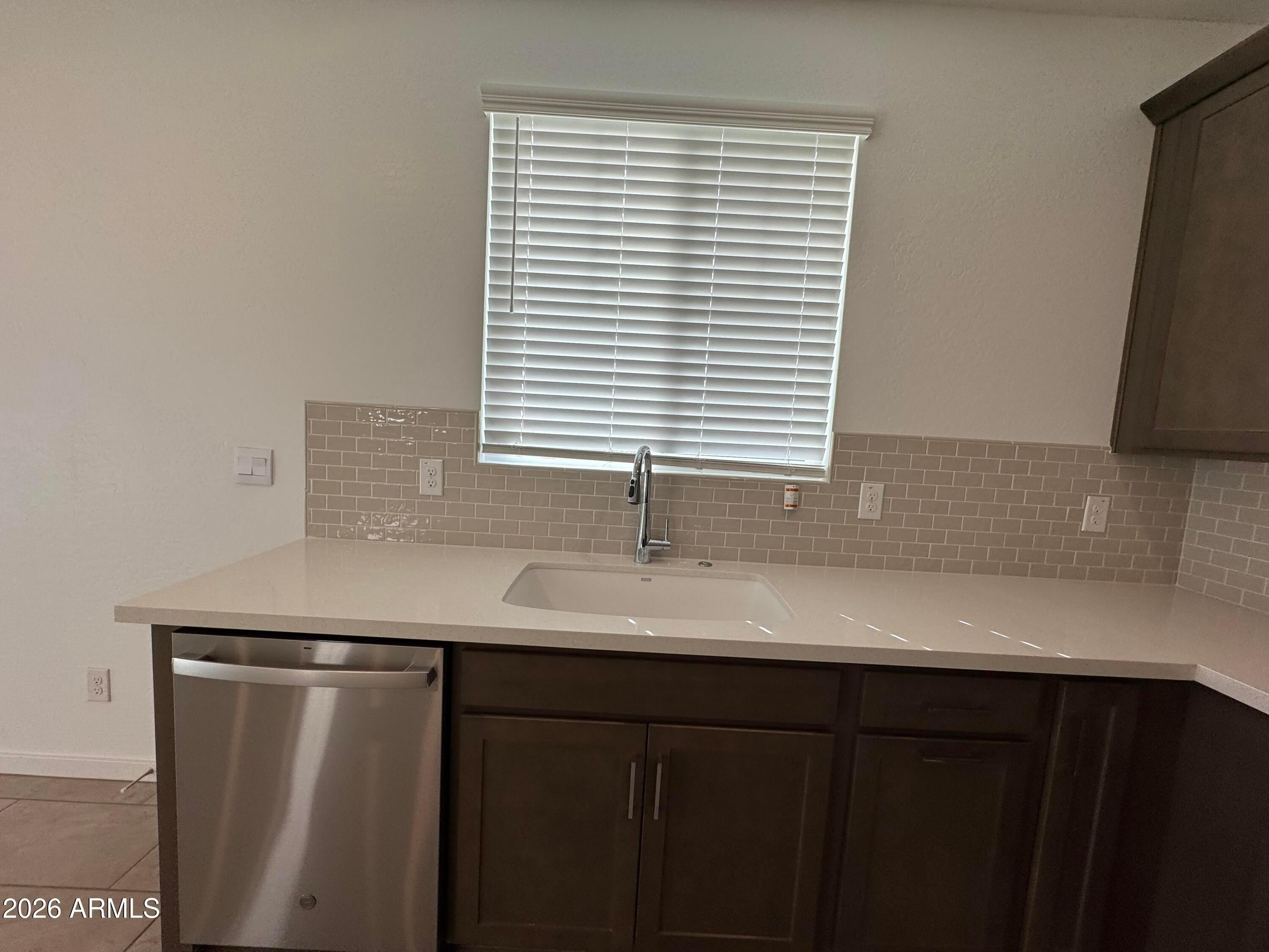 2438 West Rowel Road Phoenix, AZ 85085 - Photo 9 of 30 a kitchen with a sink and a window