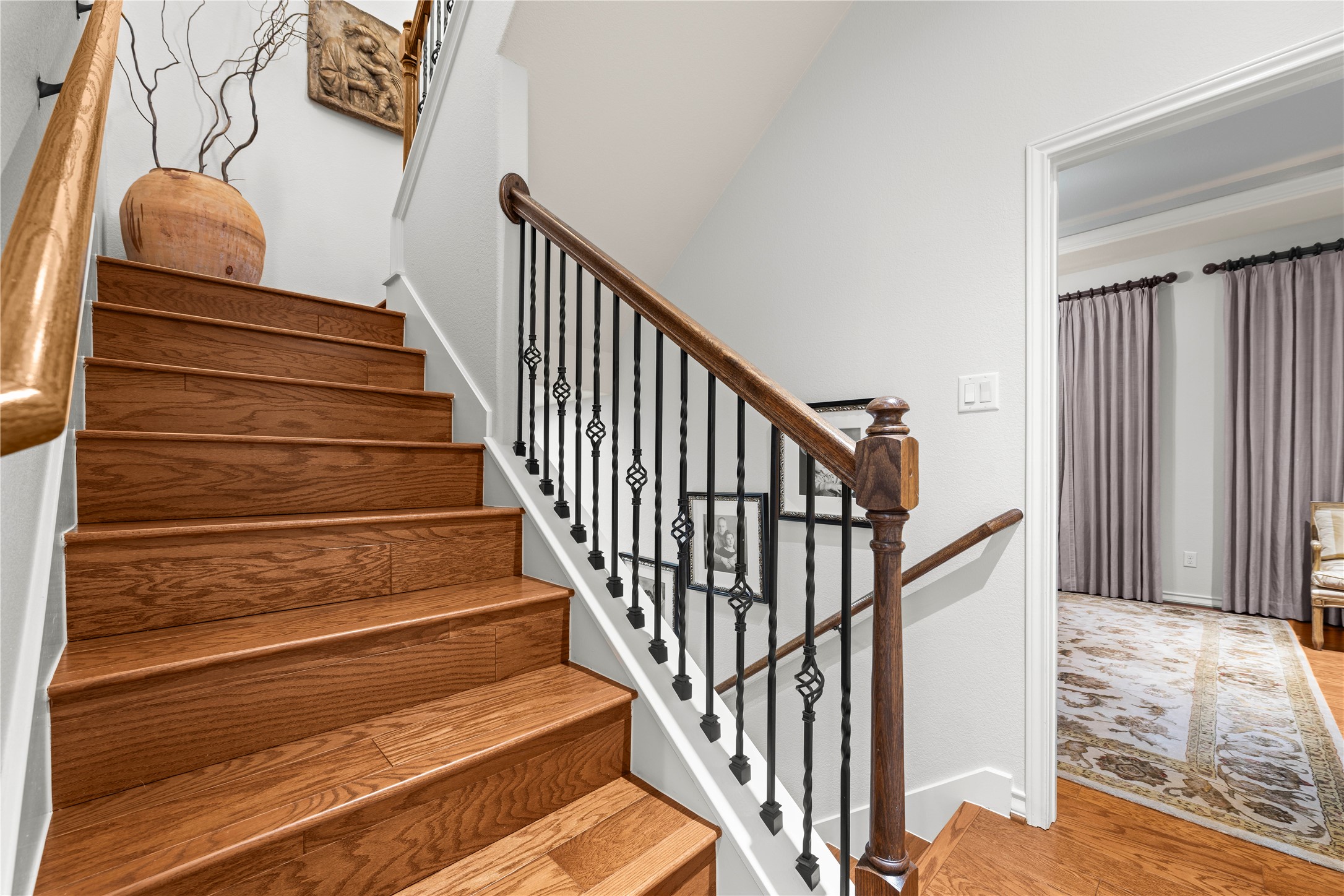 204 Adams Street Georgetown, TX 78628 - Photo 27 of 33 Rich hardwood steps ascend gracefully to the 4th-floor library, storage room, and roof deck.