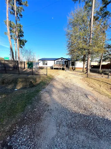 a view of a yard with swimming pool
