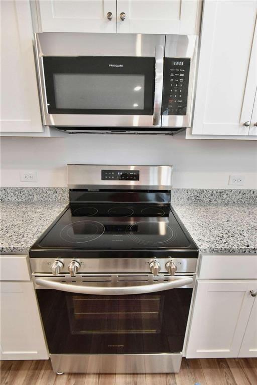 155 Star Court Pendergrass, GA 30567 - Photo 12 of 34 a stove top oven sitting inside of a kitchen