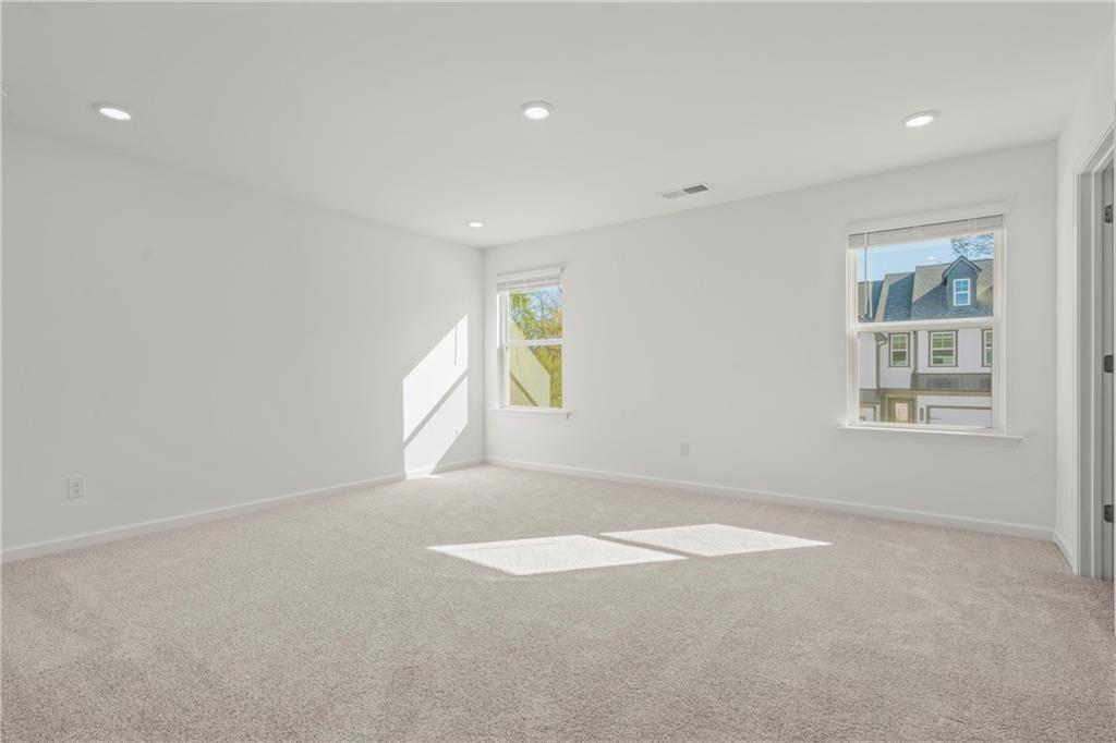 155 Star Court Pendergrass, GA 30567 - Photo 14 of 34 an empty room with windows