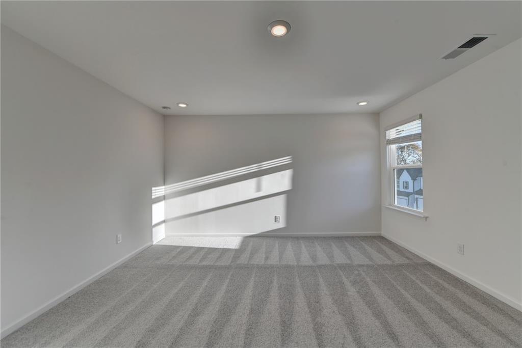 155 Star Court Pendergrass, GA 30567 - Photo 20 of 34 wooden floor in an empty room with a window