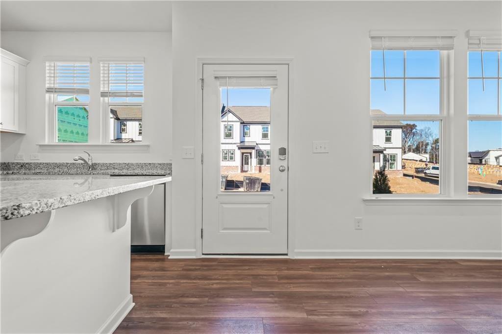 155 Star Court Pendergrass, GA 30567 - Photo 7 of 34 a view of a kitchen cabinets a sink and a window