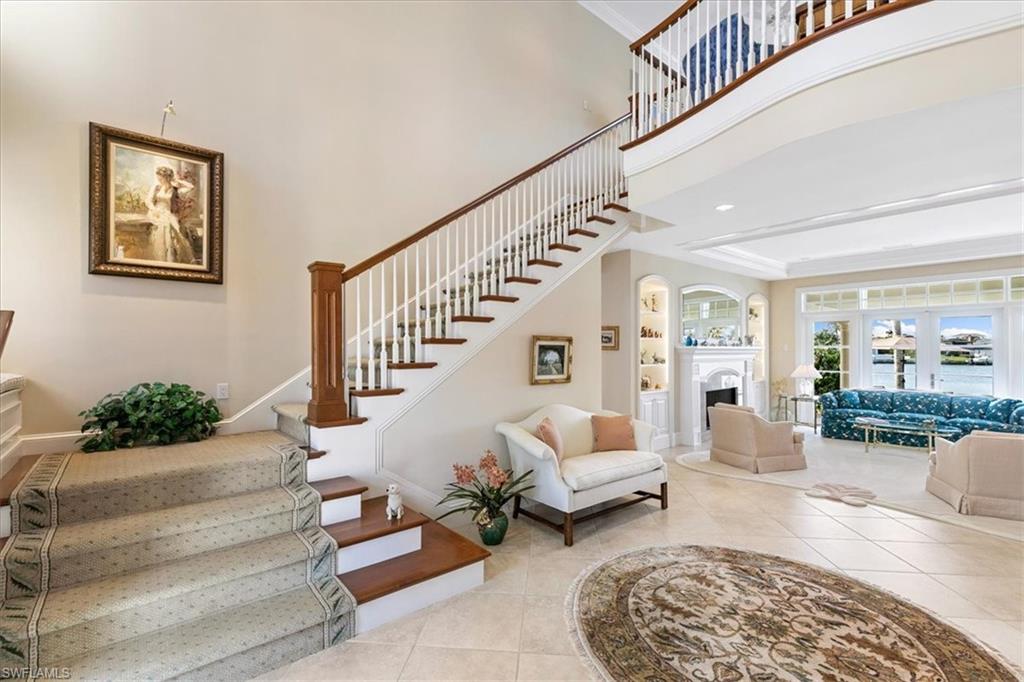 400 Springline Drive Naples, FL 34102 - Photo 23 of 32 a living room with furniture and a rug