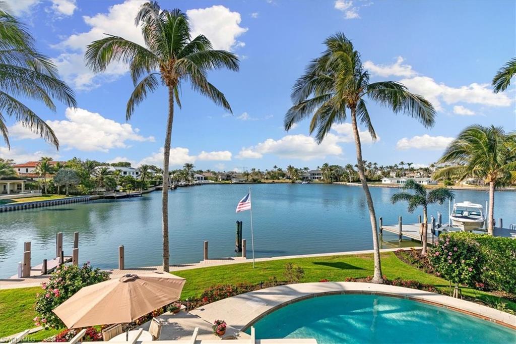 400 Springline Drive Naples, FL 34102 - Photo 25 of 32 an aerial view of a house having yard