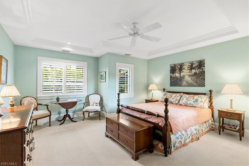 400 Springline Drive Naples, FL 34102 - Photo 28 of 32 a bedroom with a bed and a couch