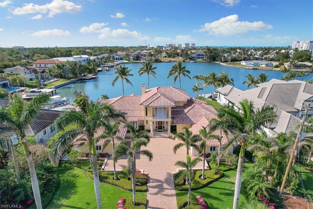400 Springline Drive Naples, FL 34102 - Photo 5 of 32 a view of a lake with a city