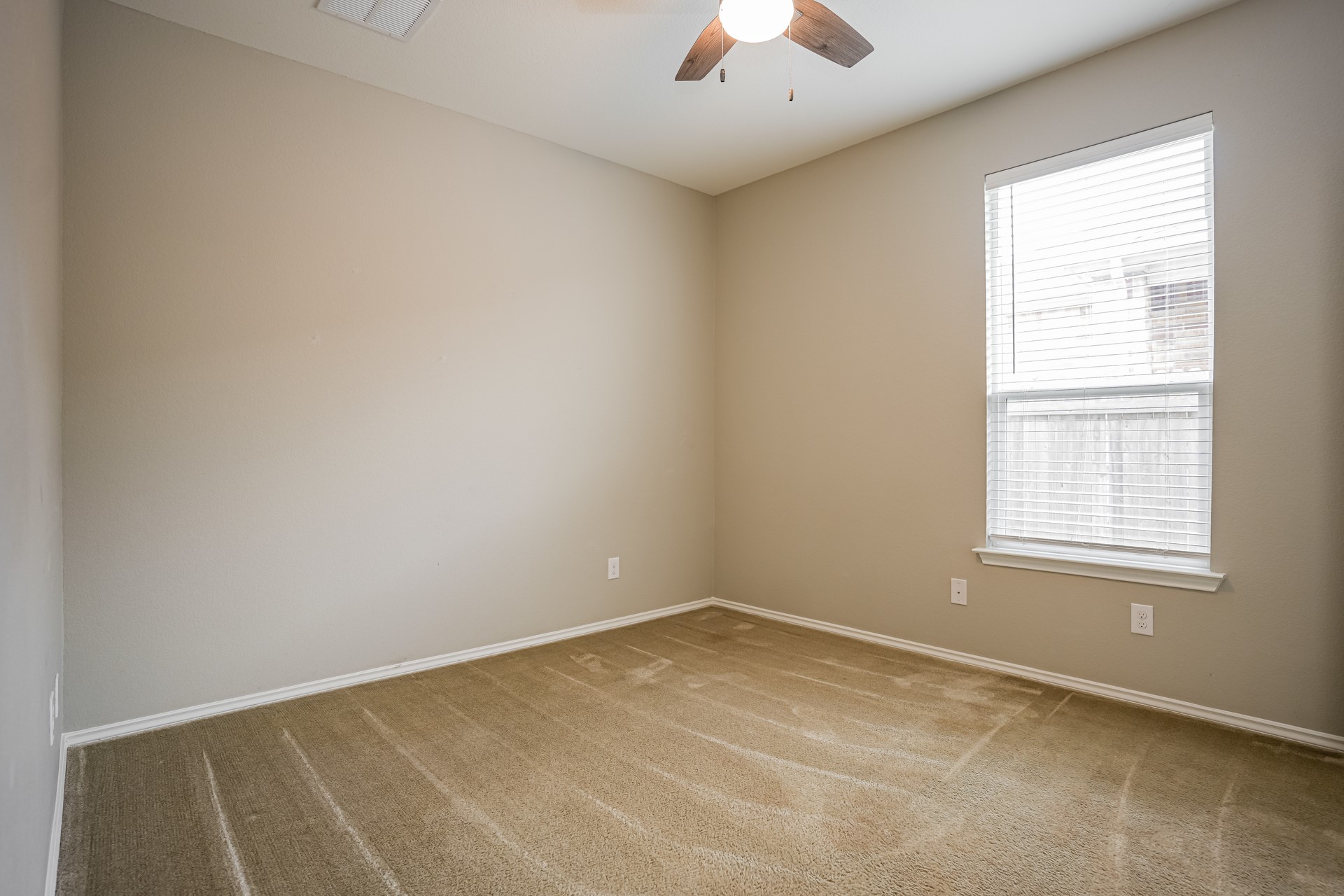 17313 Crazy Arm Road, Unit 233 Round Rock, TX 78664 - Photo 17 of 20 Bedroom 3 with carpet and ceiling fan