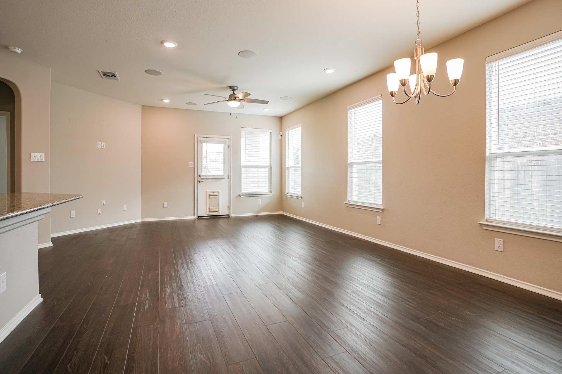 17313 Crazy Arm Road, Unit 233 Round Rock, TX 78664 - Photo 20 of 20 Open concept floor plan for living, dining and kitchen with laminate flooring.