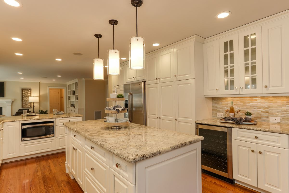 7009 North Ridge Drive Raleigh, NC 27615 - Photo 10 of 25 Nice layout in kitchen and easy access to screened porch for entertaining. Kitchen