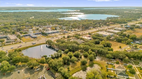 a view of a lake with large trees