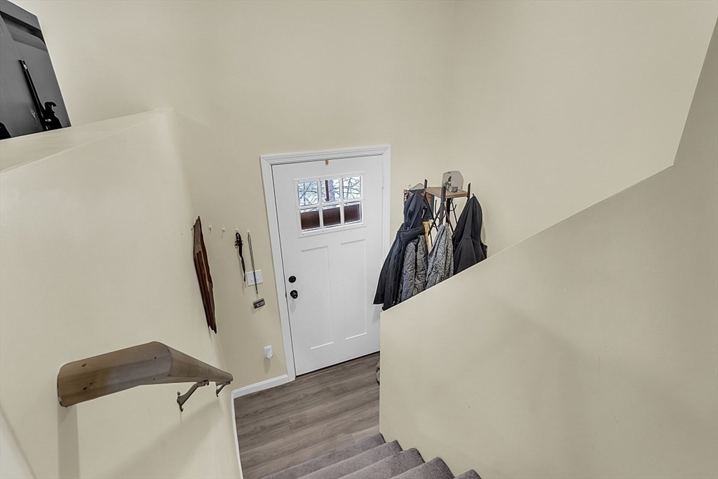 667 Brickyard Road Athol, MA 01331 - Photo 11 of 32 a view of a livingroom with wooden floor and a ceiling fan