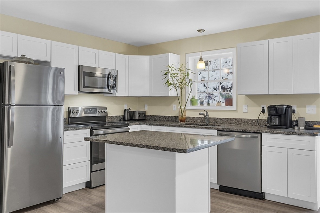 667 Brickyard Road Athol, MA 01331 - Photo 12 of 32 a kitchen with stainless steel appliances granite countertop a refrigerator sink and stove