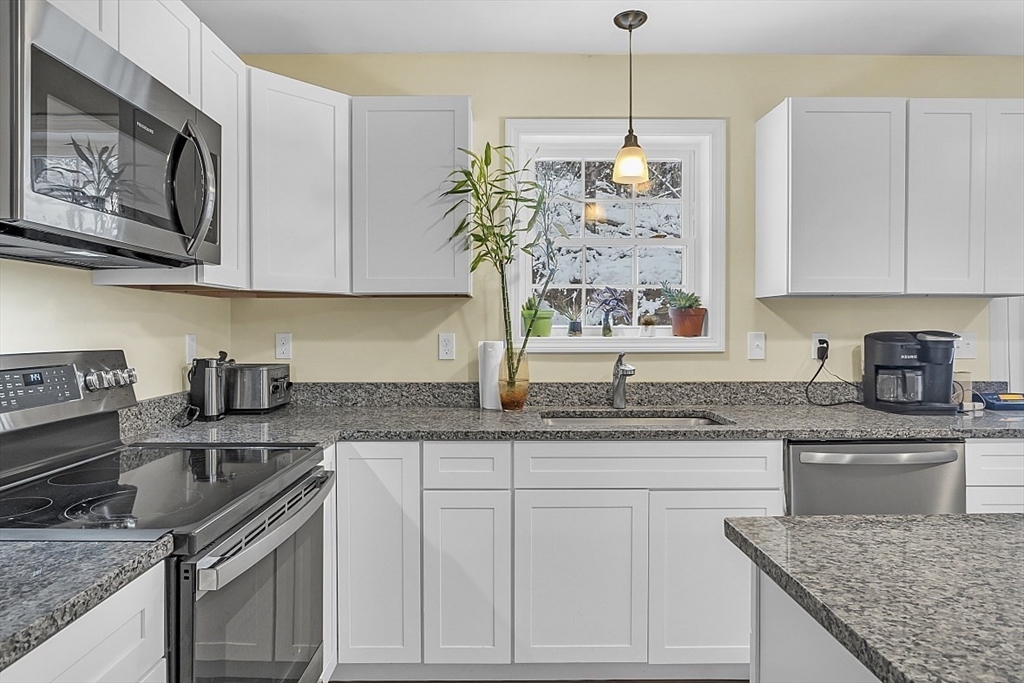 667 Brickyard Road Athol, MA 01331 - Photo 14 of 32 a kitchen with stainless steel appliances granite countertop a sink stove and cabinets