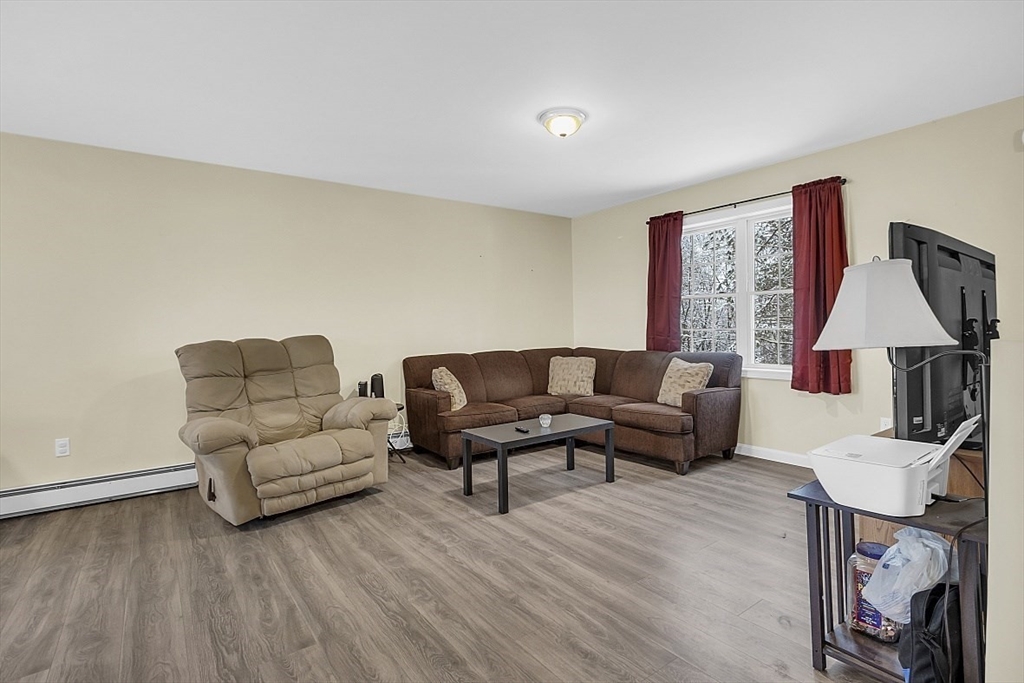 667 Brickyard Road Athol, MA 01331 - Photo 18 of 32 a living room with furniture and a wooden floor