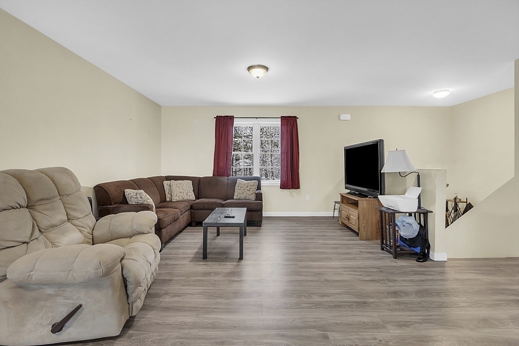 667 Brickyard Road Athol, MA 01331 - Photo 19 of 32 a living room with furniture and a flat screen tv