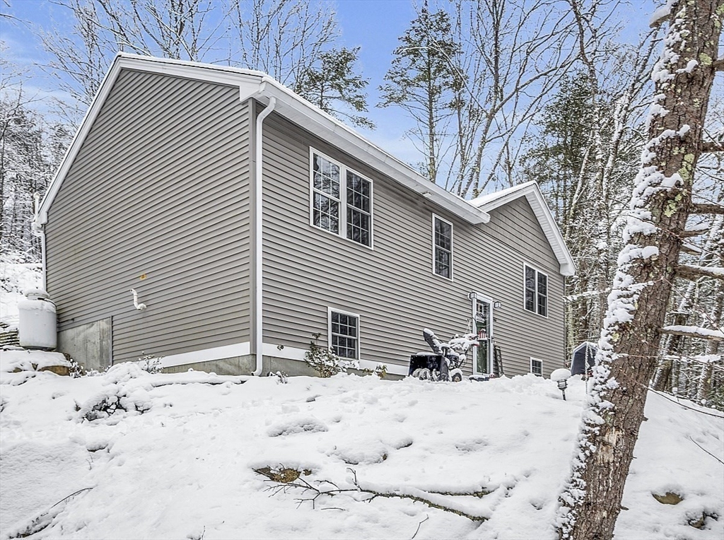 667 Brickyard Road Athol, MA 01331 - Photo 2 of 32 a view of a house with snow on the roof